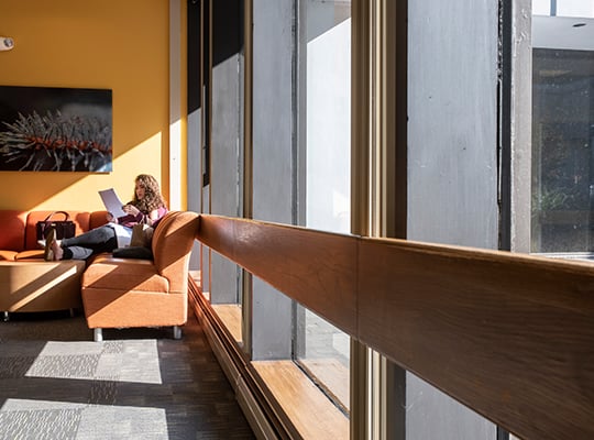 student on sofa in lounge